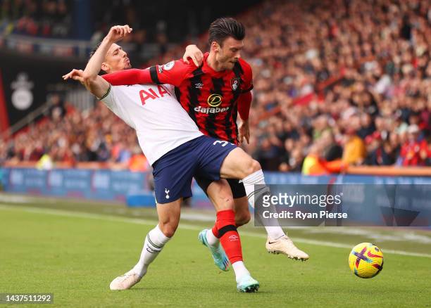 Clement Lenglet of Tottenham Hotspur is challenged by Kieffer Moore of AFC Bournemouth during the Premier League match between AFC Bournemouth and...