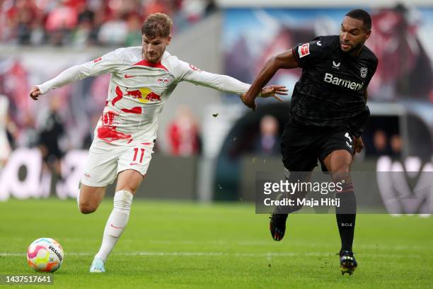Timo Werner of RB Leipzig is challenged by Jonathan Tah of Bayer 04 Leverkusen during the Bundesliga match between RB Leipzig and Bayer 04 Leverkusen...