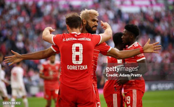 Leon Goretzka celebrates with Eric Maxim Choupo-Moting of Bayern Munich after scoring their team's fourth goal during the Bundesliga match between FC...
