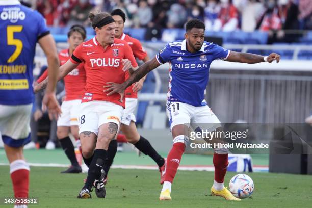 Anderson Lopes of Yokohama F.Marinos and Alexander Scholz of Urawa Red Diamonds compete for the ball during the J.LEAGUE Meiji Yasuda J1 33rd Sec....