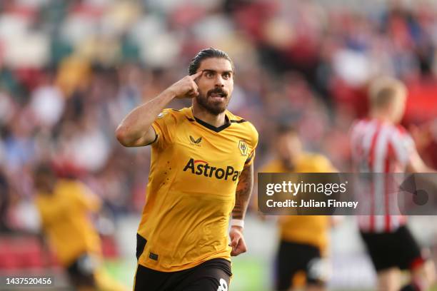 Ruben Neves of Wolverhampton Wanderers celebrates scoring their side's first goal during the Premier League match between Brentford FC and...