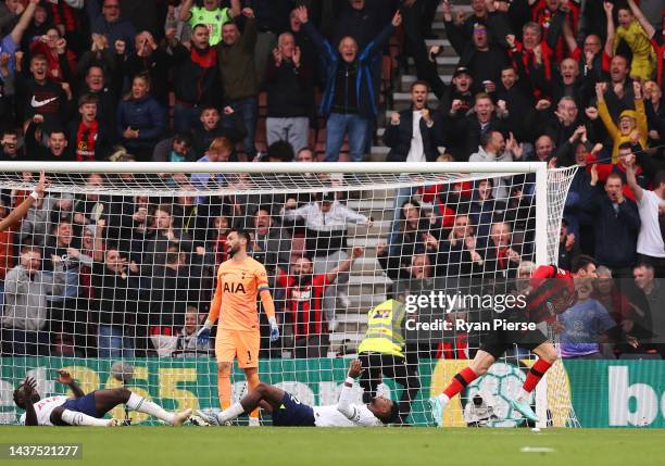 Players of Tottenham Hotspur looks dejected as Kieffer Moore of AFC Bournemouth celebrates scoring their side's second goal during the Premier League...