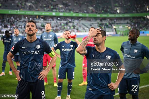 Anthony Losilla and Cristian Gamboa of VfL Bochum react after the final whistle of the Bundesliga match between VfL Wolfsburg and VfL Bochum 1848 at...
