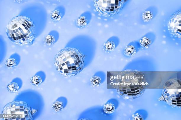 merry christmas and happy new year invitation. silver disco balls on  pastel blue violet very peri 2022 color background. - mirror ball background stock pictures, royalty-free photos & images