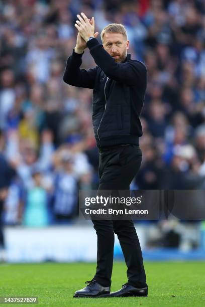 Graham Potter, Head Coach of Chelsea applauds the fans after their sides defeat during the Premier League match between Brighton & Hove Albion and...