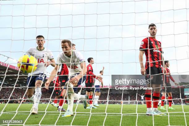 Harry Kane of Tottenham Hotspur recovers the ball from the net as they prepare to return to their own half after Ben Davies scores their side's...