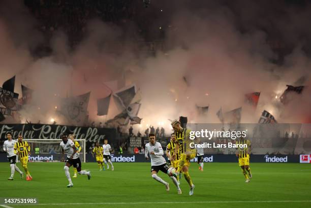 Nico Schlotterbeck of Borussia Dortmund is challenged by Jesper Lindstrom of Eintracht Frankfurt during the Bundesliga match between Eintracht...