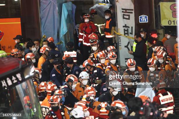 Emergency services treat injured people after a stampede on October 30, 2022 in Seoul, South Korea. At least 50 people were reported to be receiving...