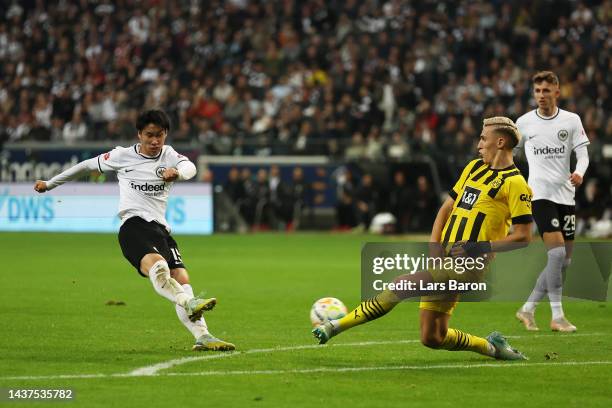 Daichi Kamada of Eintracht Frankfurt scores their side's first goal during the Bundesliga match between Eintracht Frankfurt and Borussia Dortmund at...