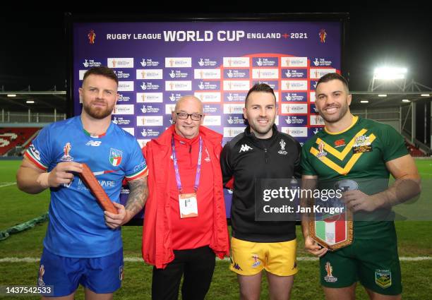 James Tedesco of Australia and Nathan Brown of Italy pose for a photo alongside the National Lottery Winner ahead of the Rugby League World Cup 2021...