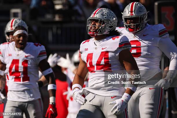 Tuimoloau of the Ohio State Buckeyes celebrates after intercepting a pass against the Penn State Nittany Lions during the first half at Beaver...