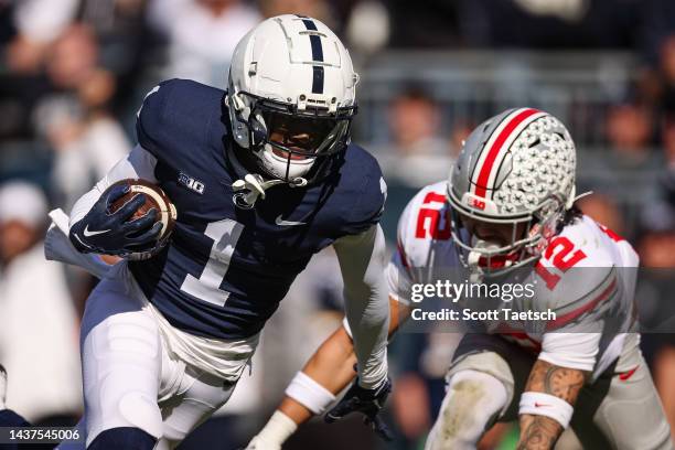 KeAndre Lambert-Smith of the Penn State Nittany Lions runs for a touchdown against Lathan Ransom of the Ohio State Buckeyes during the first half at...