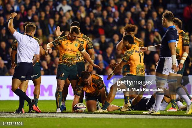 James Slipper of Australia celebrates scoring their side's first try with teammates during the Autumn International match between Scotland and...