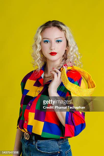 beautiful woman wearing colorful shirt - schönheit retro stock-fotos und bilder