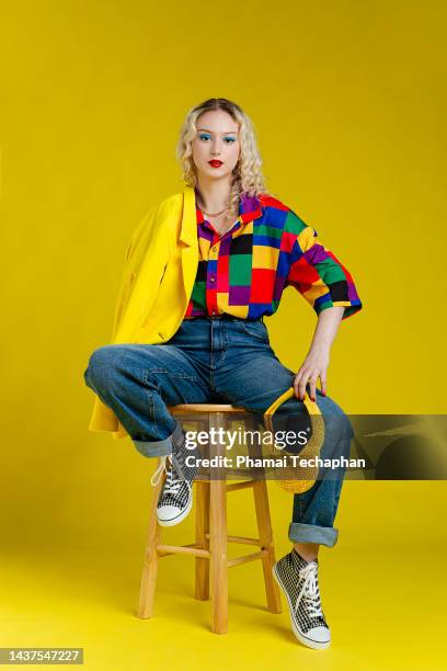 beautiful woman wearing colorful shirt - sgabello foto e immagini stock