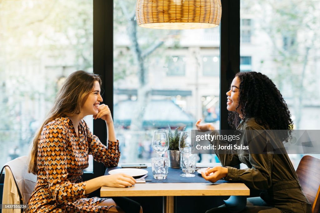 Two women sitting on a restaurant