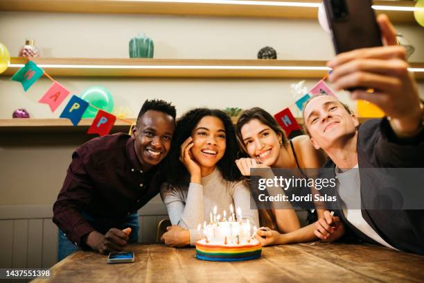 group of multiracial young people in a birthday party - cake display stock-fotos und bilder