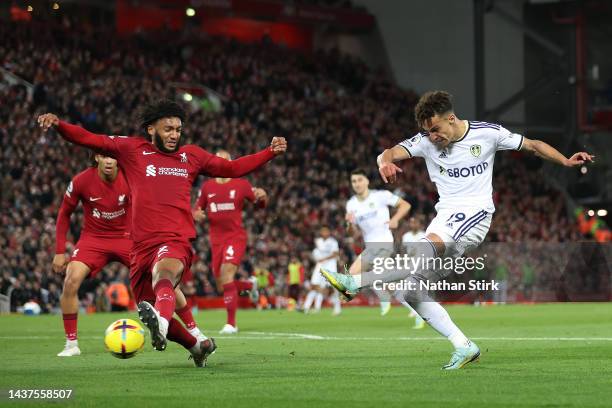 Rodrigo Moreno of Leeds United shoots while under pressure from Joe Gomez of Liverpool during the Premier League match between Liverpool FC and Leeds...