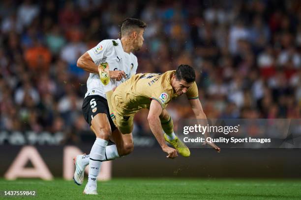 Gabriel Paulista of Valencia CF competes for the ball with Robert Lewandowski of FC Barcelona during the LaLiga Santander match between Valencia CF...