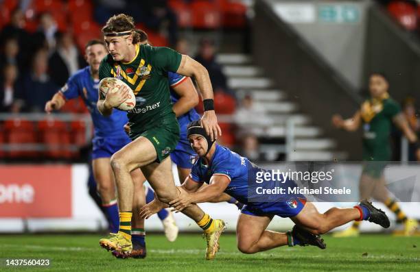 Campbell Graham of Australia goes over to score their sides tenth try during Rugby League World Cup 2021 Pool B match between Australia and Italy at...