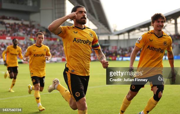 Ruben Neves of Wolverhampton Wanderers celebrates scoring their side's first goal during the Premier League match between Brentford FC and...