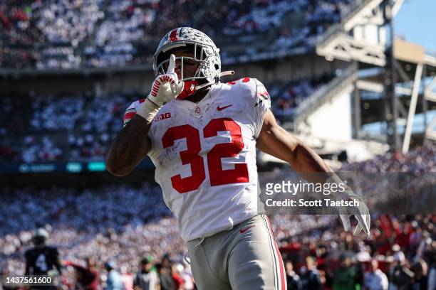 TreVeyon Henderson of the Ohio State Buckeyes celebrates after scoring a touchdown against the Penn State Nittany Lions during the second half at...