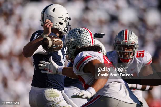 Tuimoloau of the Ohio State Buckeyes causes Sean Clifford of the Penn State Nittany Lions to fumble the ball during the second half at Beaver Stadium...