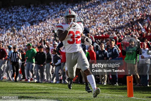 TreVeyon Henderson of the Ohio State Buckeyes runs for a touchdown against the Penn State Nittany Lions during the second half at Beaver Stadium on...