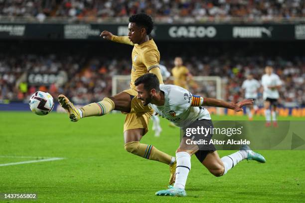 Alejandro Balde of FC Barcelona and Jose Luis Gaya of Valencia CF battle for the ball the LaLiga Santander match between Valencia CF and FC Barcelona...