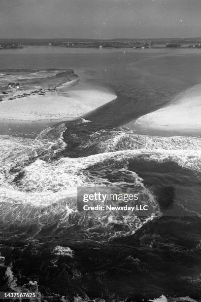 Westhampton Beach, N.Y.: Aerial view of a portion of Westhampton Beach, New York, where high tides and strong winds from Hurricane Donna cut a broad...