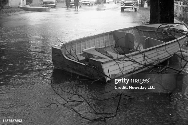 An empty boat is washed up on the street in East Rockway during the high tides of Hurricane Donna on September 12, 1960.