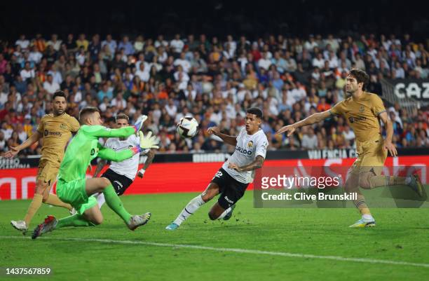 Marcos Andre of Valencia CF has their shot saved by Marc-Andre ter Stegen of FC Barcelona during the LaLiga Santander match between Valencia CF and...
