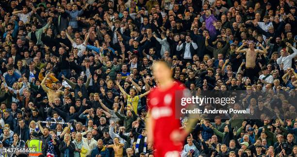 Fans of Leeds United celebrate during the Premier League match between Liverpool FC and Leeds United at Anfield on October 29, 2022 in Liverpool,...
