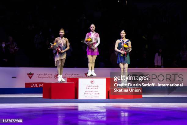 Starr Andrews of the United States, Rinka Watanabe of Japan, and Young You of South Korea on the podium after the women's free skate during the ISU...