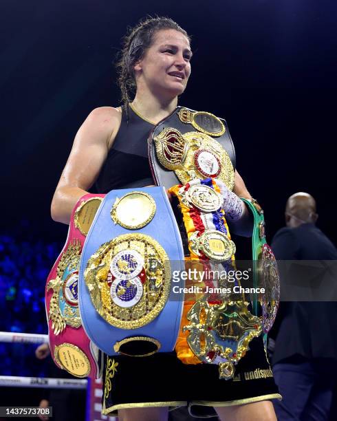 Katie Taylor collects their title belts after defeating Karen Elizabeth Carabajal during the IBF, WBA, WBC and WBO Undisputed Lightweight World Title...
