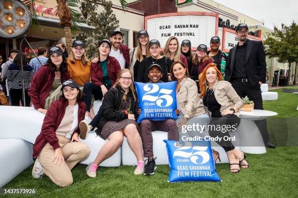 Volunteers and Staff pose in front of the Trustees Theater during the 25th SCAD Savannah Film Festival on October 29, 2022 in Savannah, Georgia.