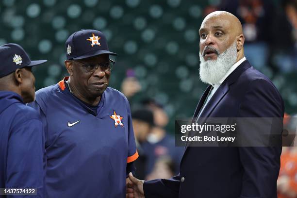 Manager Dusty Baker of the Houston Astros talks with former Major League Baseball player and executive director of the Major League Baseball Players...