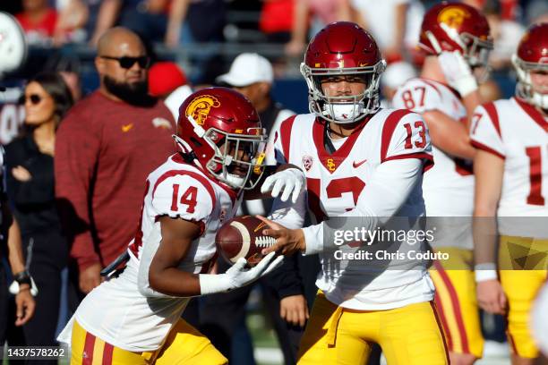 Running back Raleek Brown and quarterback Caleb Williams of the USC Trojans warm up before the game against the Arizona Wildcats at Arizona Stadium...