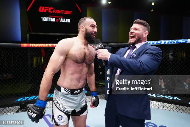 Roman Dolidze of Georgia is interviewed by Michael Bisping after his middleweight fight against Phil Hawes during the UFC Fight Night event at UFC...