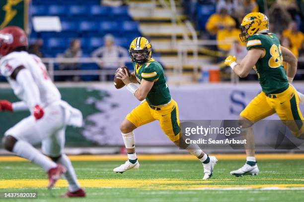 Cam Miller of the North Dakota State Bison rolls out of the pocket against the Illinois State Redbirds at FARGODOME on October 29, 2022 in Fargo,...