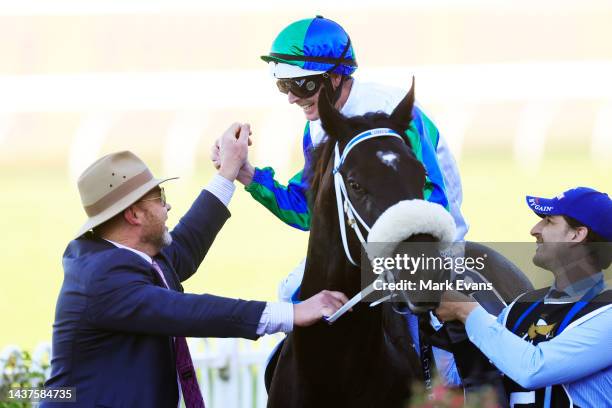 Luke Nolen on I Wish I Win greets trainer Peter Moody as he returns to scale after winning race 8 the XXXX Golden Eagle during Sydney Racing at...