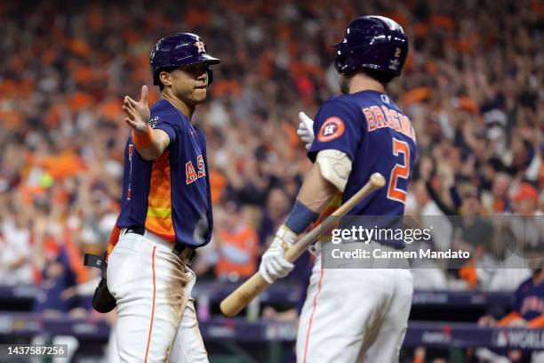 Jeremy Pena of the Houston Astros celebrates a run with Alex Bregman in the first inning against the Philadelphia Phillies in Game Two of the 2022...