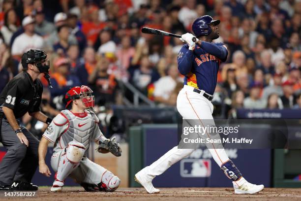 Yordan Alvarez of the Houston Astros hits an RBI double in the first inning against the Philadelphia Phillies in Game Two of the 2022 World Series at...