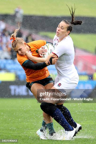 Emily Scarratt of England is tackled by Georgina Friedrichs of Australia during the Rugby World Cup 2021 New Zealand Quarterfinal match between...