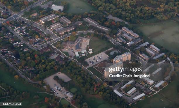 residential neighbourhood with school as seen from above - elementary school building stock pictures, royalty-free photos & images