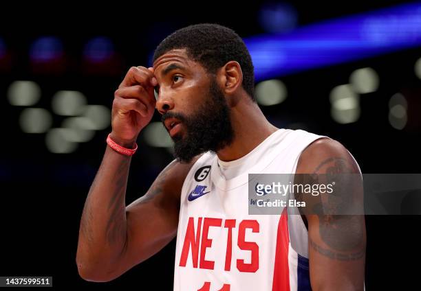 Kyrie Irving of the Brooklyn Nets reacts in the fourth quarter against the Indiana Pacers at Barclays Center on October 29, 2022 in the Brooklyn...