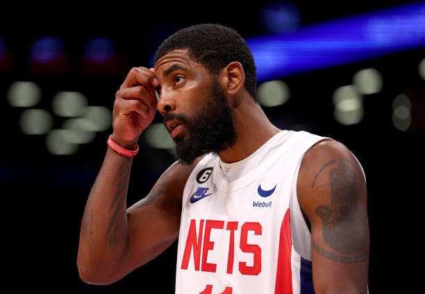 Kyrie Irving of the Brooklyn Nets reacts in the fourth quarter against the Indiana Pacers at Barclays Center on October 29, 2022 in the Brooklyn...