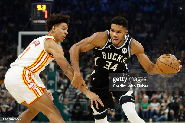 Giannis Antetokounmpo of the Milwaukee Bucks drives to the basket against Jalen Johnson of the Atlanta Hawks during the second half of the game at...
