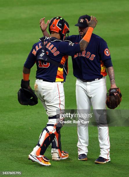 Martin Maldonado and Ryan Pressly of the Houston Astros embrace after a win over the Philadelphia Phillies in Game Two of the 2022 World Series at...