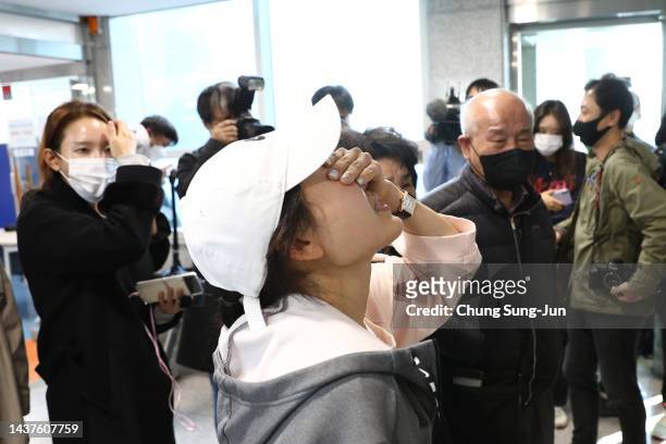 Relatives of missing people weep at a community service center on October 30, 2022 in Seoul, South Korea. 149 people have been reported killed and at...